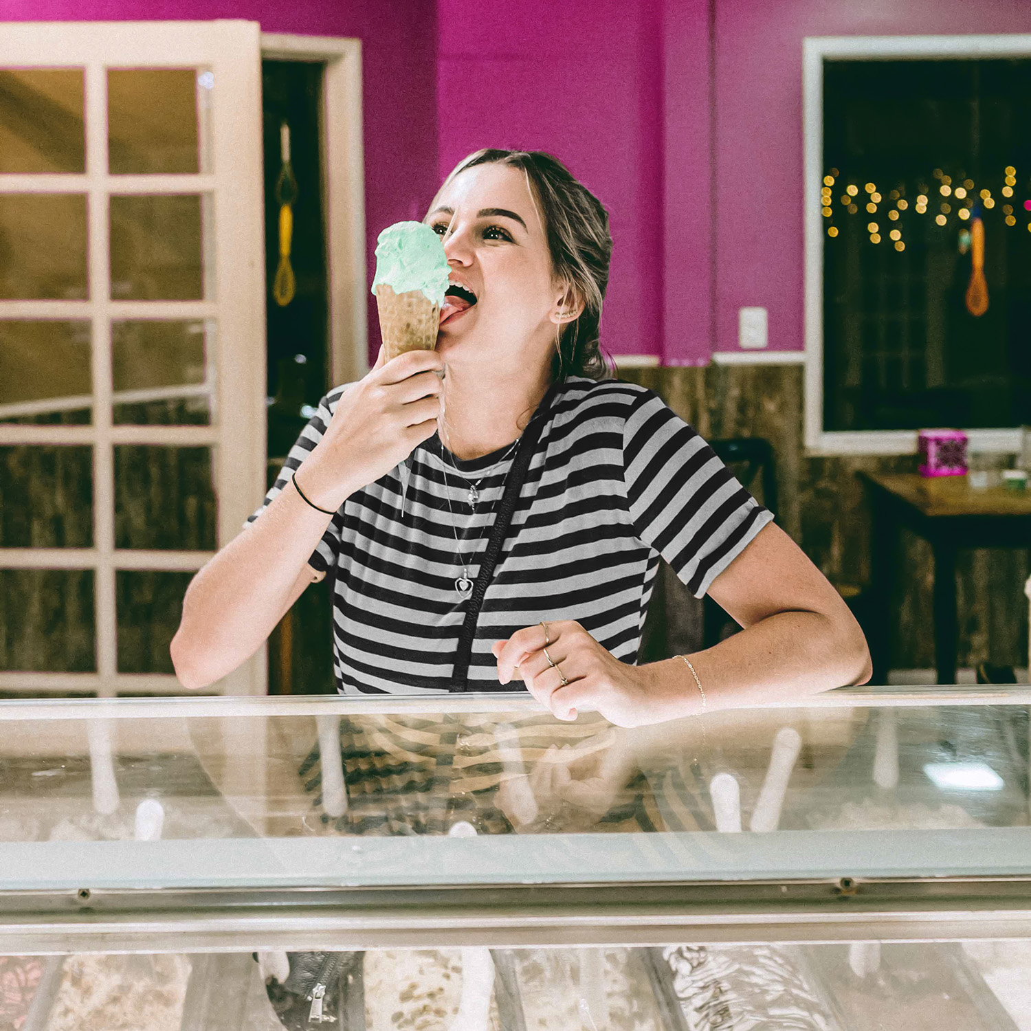 girl licking ice cream cone